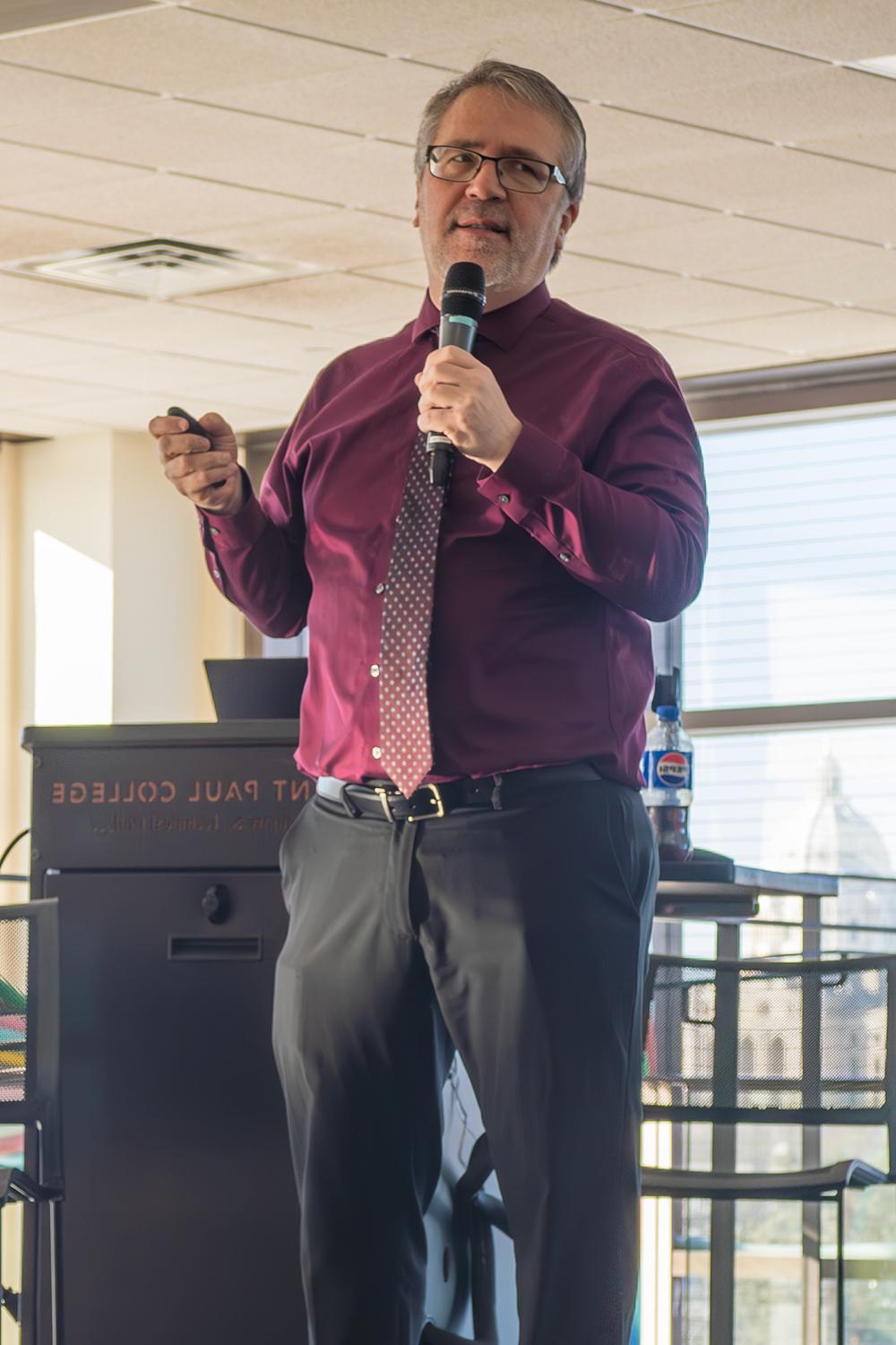 Chad Dull speaking in front of an SPC podium